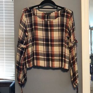 Cropped long sleeve top with statement sleeves